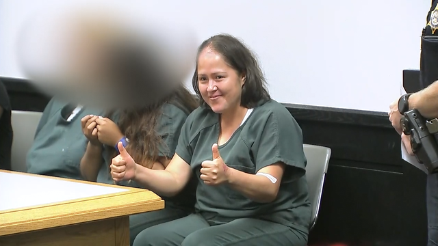 Woman accused of killing husband, 4 children behaves oddly in first court appearance