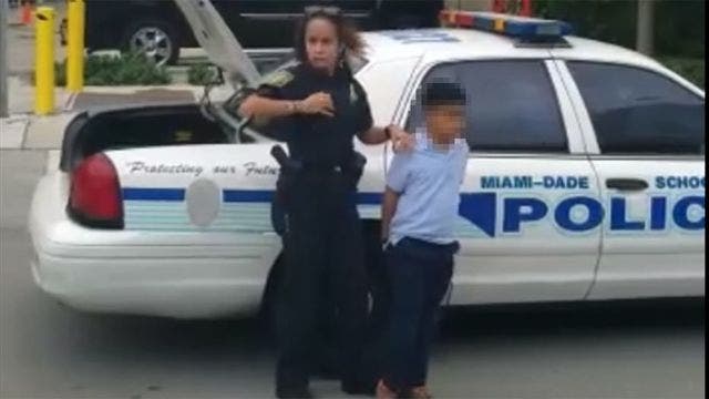 Boy handcuffed after allegedly attacking teacher at school