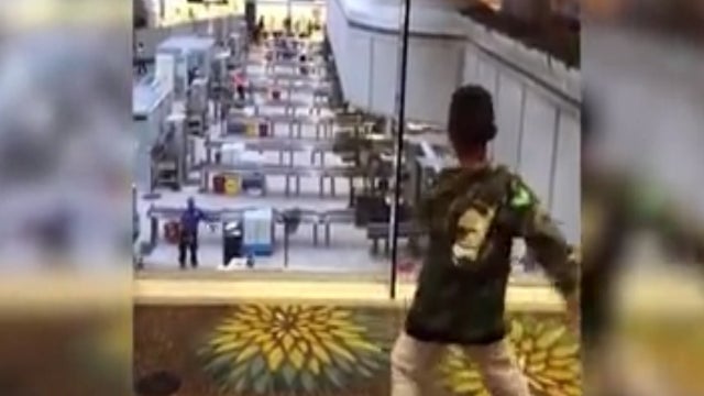 Dance-off between TSA agent and boy at OIA