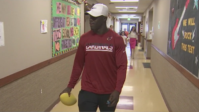 Arizona Cardinals cornerback Elie Bouka teaches sportsmanship at local academy