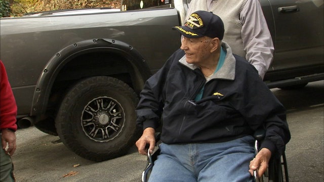 WWII veteran gets help to retire worn American flag, given new one