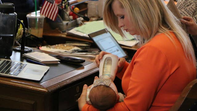 Lawmaker returns to work at Iowa Capitol with newborn baby by her side