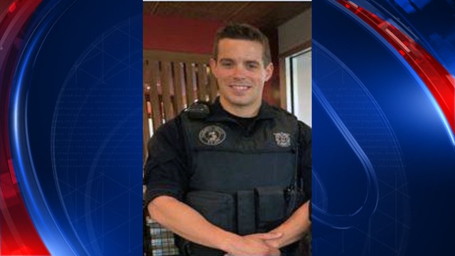 Police officer fatally shot while serving arrest warrant