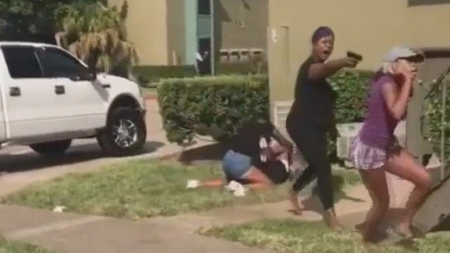 Texas mom pulls gun on teen girl amid daughter's brawl, video shows