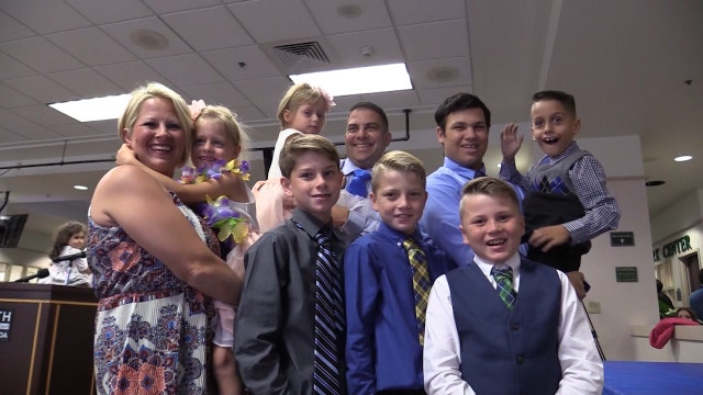 Orlando police officer adopts 3 kids on National Adoption Day