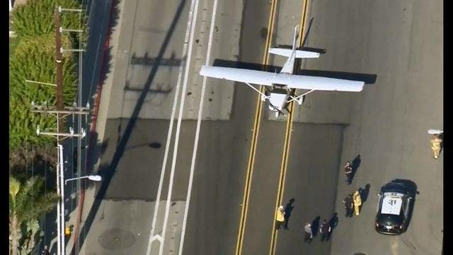 Small plane lands safely on a street in Huntington Beach
