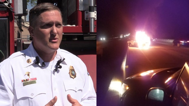 Passing firefighter pulls woman from burning car