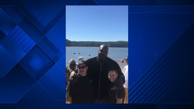 Shaq poses with Sandy Springs police at Special Olympics Georgia Polar Plunge