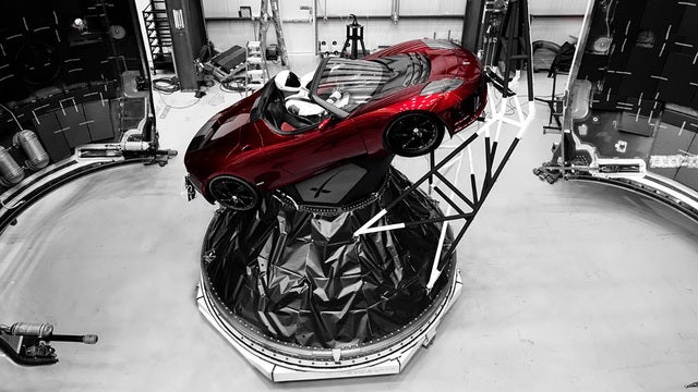 SpaceX 'Starman' at wheel of sports car flying on new rocket
