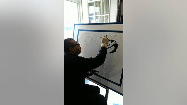 Grant school unveils tiger painting, a janitorial labor of love