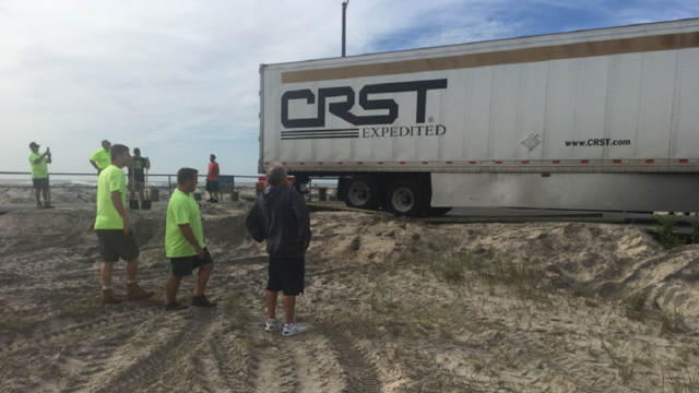Tractor trailer makes wrong turn, gets stuck on boardwalk down shore