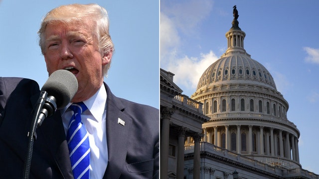 Trump signs $1.3 trillion budget after threatening veto