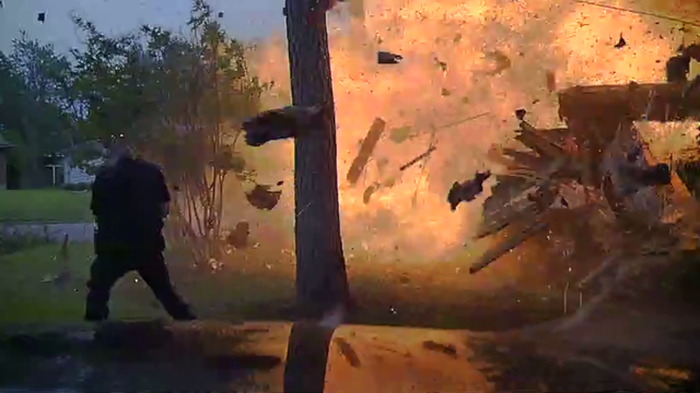 Video shows officers arriving just as Hurst home explodes