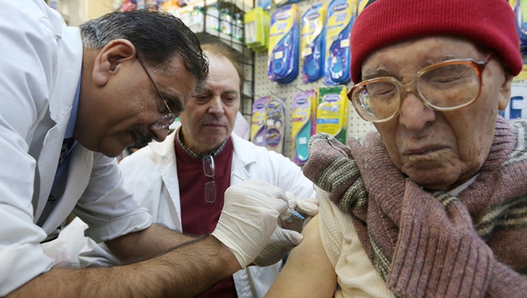 fec97bfa-Man injected with flu vaccine (GETTY)-408200