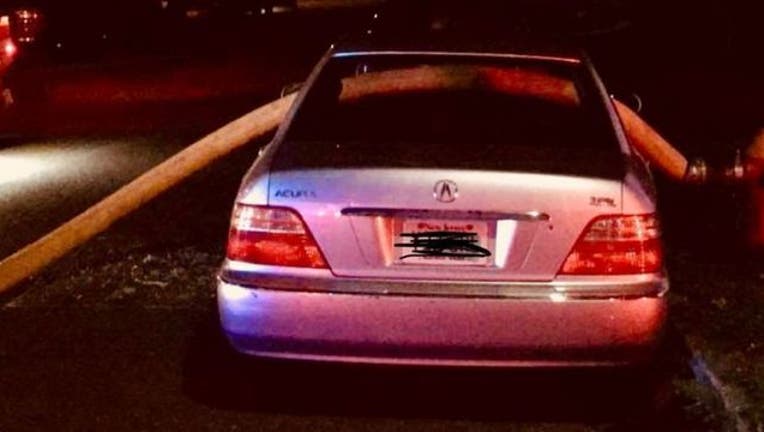 Hamilton Township firefighters broke this car's windows to run a hose through it, because it was blocking the hydrant-404023