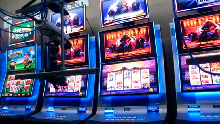 This Feb. 10, 2020 photo shows slot machines in a secure room at the Hard Rock casino in Atlantic City N.J. that have been connected to the internet as part of a new product offering. The technology lets people use the internet to gamble on real-life slot machines that are inside the casino. (AP Photo/Wayne Parry)