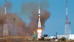 Russian, American crew reach space station using a fast-track maneuver