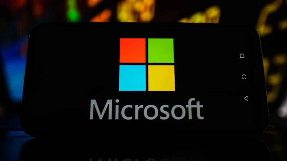 In this photo illustration a Microsoft logo seen displayed