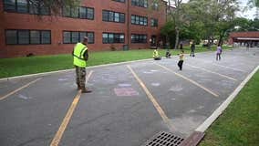 Afghan children evacuees create chalk art at NJ military base