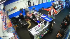 VIDEO: Gun battle erupts after store employee returns fire on would-be robbers