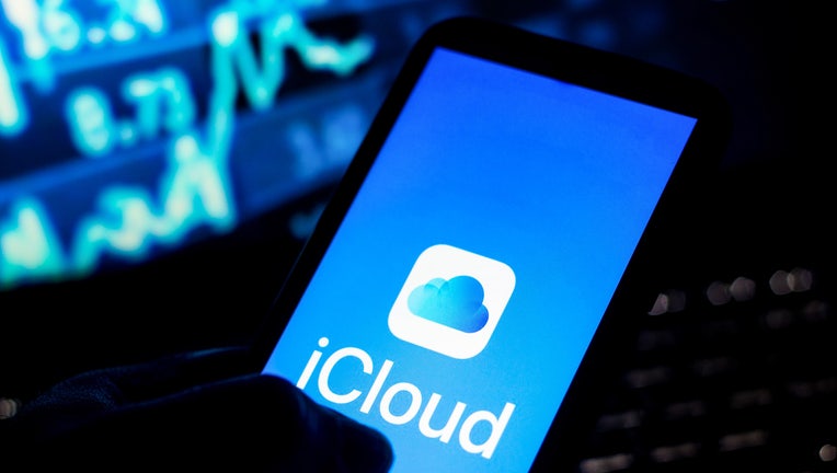 In this photo illustration the iCloud logo seen displayed on
