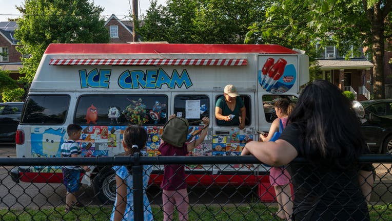 WASHINGTON, DC - MAY 19: People buy ice cream from an ice cream