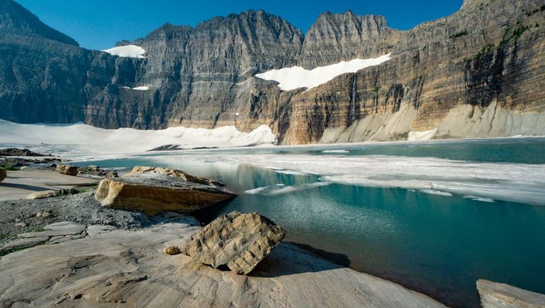 525dc652-Glacial striations and receding Grinnell and Salamander glaciers in cirque, Glacier National Park, Montana.