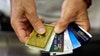 Consumers are piling on credit card debt, flashing signs of potential crisis