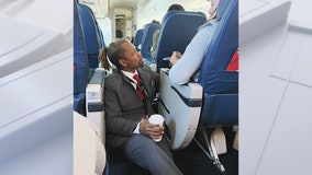 Delta flight attendant sits, comforts jittery passenger in touching photo