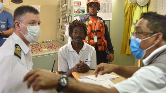 Adrift for 24 days, sailor rescued by Colombian navy after scrawling 'help' on boat