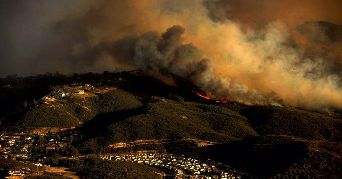 Southern California wildfires spur mass evacuations as wind whips ...