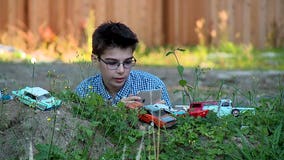 11-year-old with autism finds outlet with miniature car photography
