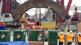 Crews pulling pieces of Seattle tunnel machine Bertha to surface