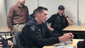 Bremerton officer shot last month returns to work
