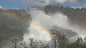 Water flowing over emergency spillway at Lake Oroville