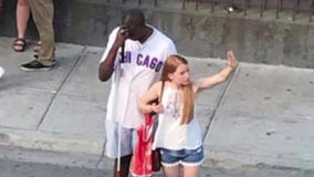 Woman praised for helping blind Cubs fan hail cab after game