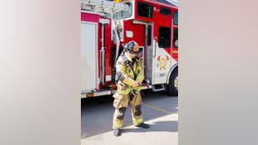 Firefighter stands for 1 minute for every firefighter who died on 9/11