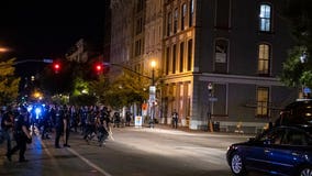 Louisville police and soldiers return fire, killing man