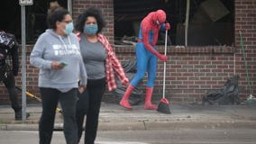 Volunteers clean up trash, graffiti and debris following Twin Cities protests