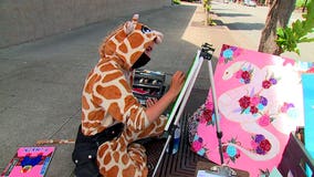 Georgia the Giraffe spreads joy to Redmond shoppers