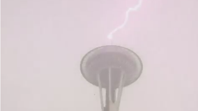 Lightning strikes Space Needle, snow falls across Puget Sound as wild weather reigns