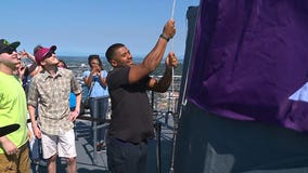 Russell Wilson raises flag at Space Needle for Childhood Cancer Awareness Month