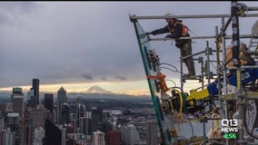 Glass panels weighing over a ton each being installed on Space Needle