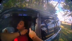 Video shows police officer, good Samaritan bend door of burning car to free women