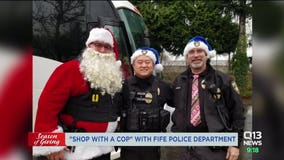 Police officers spread holiday cheer with shopping spree