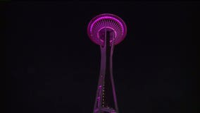 Russell Wilson raises flag at Space Needle for Childhood Cancer