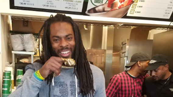 Star cornerback Richard Sherman munches on some wings, enters the restaurant biz