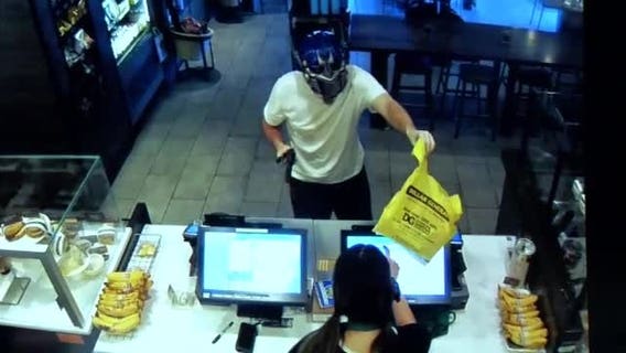 Dramatic video shows Starbucks customer fighting off armed robber