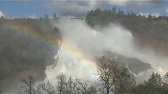 Water flowing over emergency spillway at Lake Oroville
