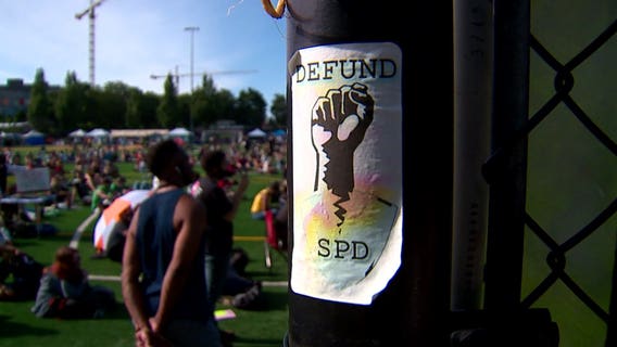 Seattle City Council votes to cut police budget, officers